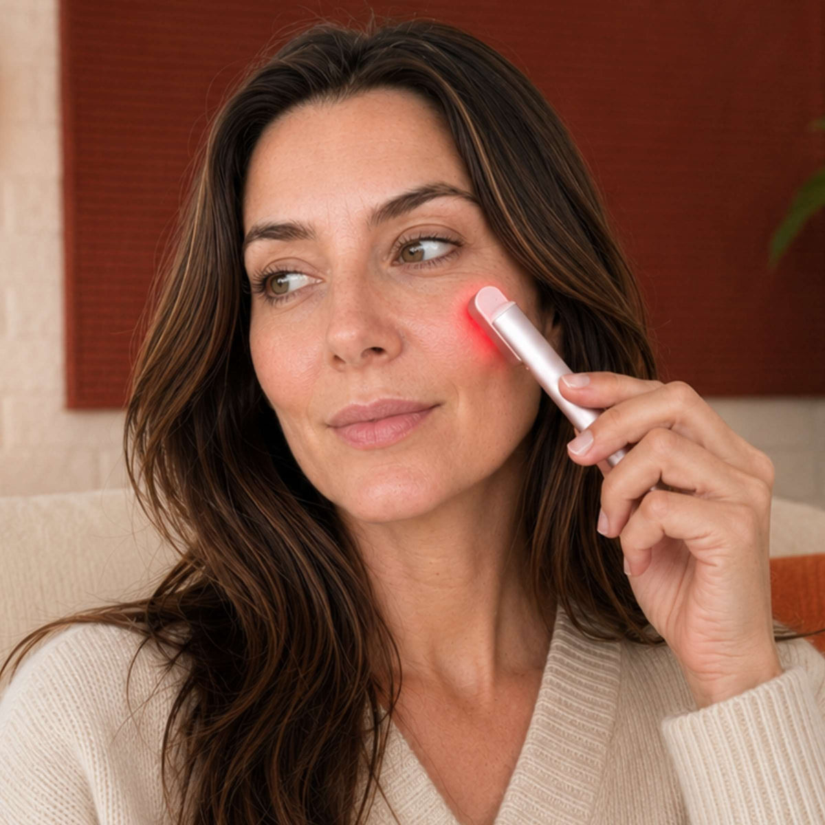 Auréa™ Precision LED Skincare Wand used on the face